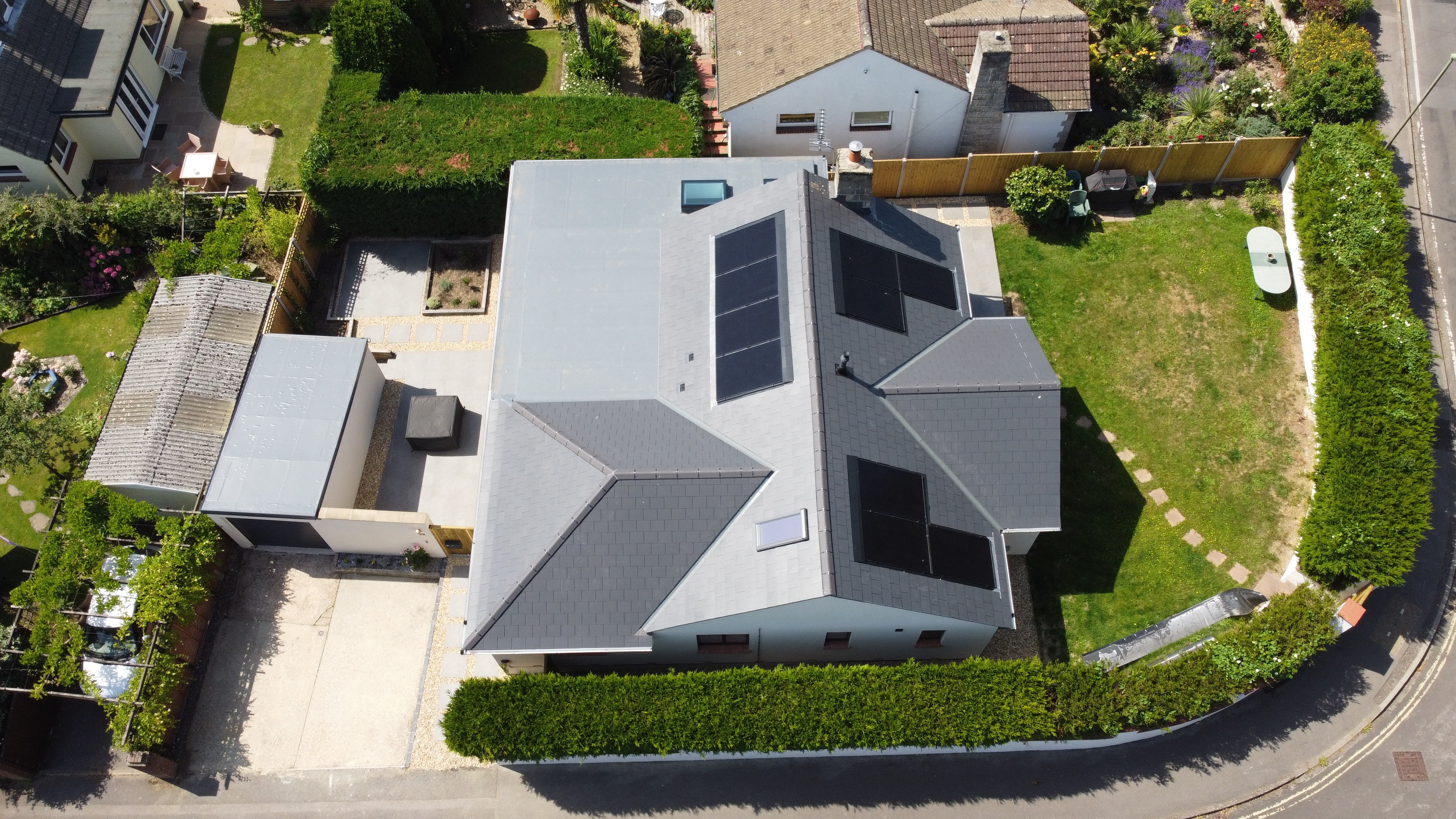 Overhead aerial view of solar installation on modern home roof