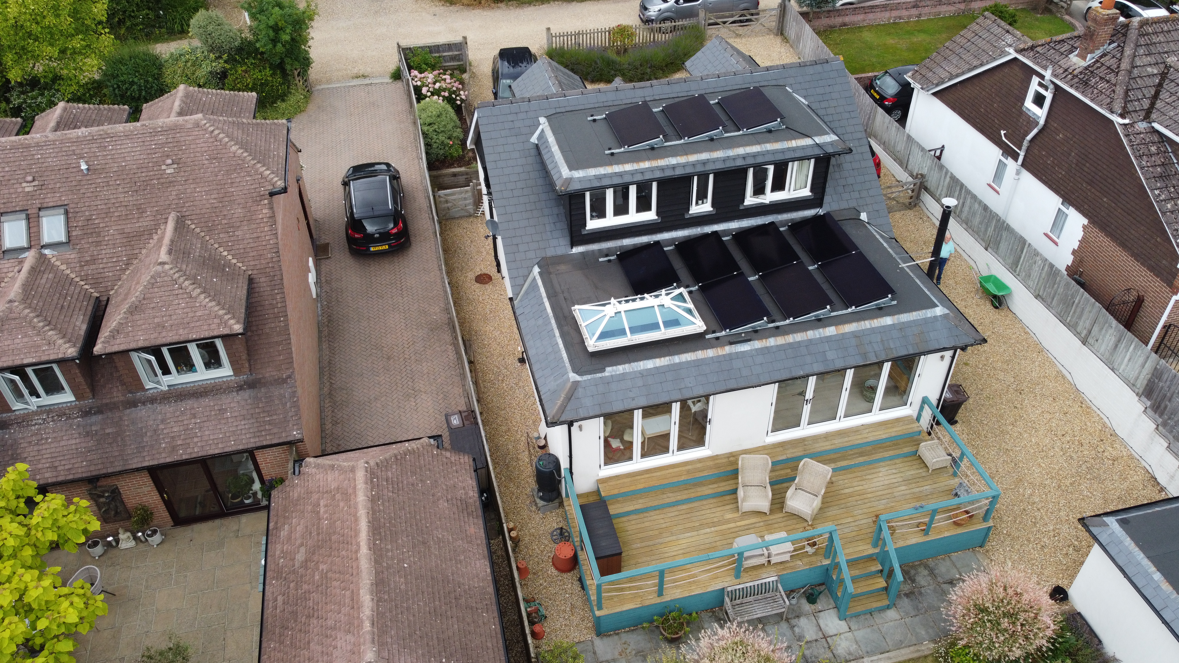 Drone view of solar installation on rural property with landscaped garden