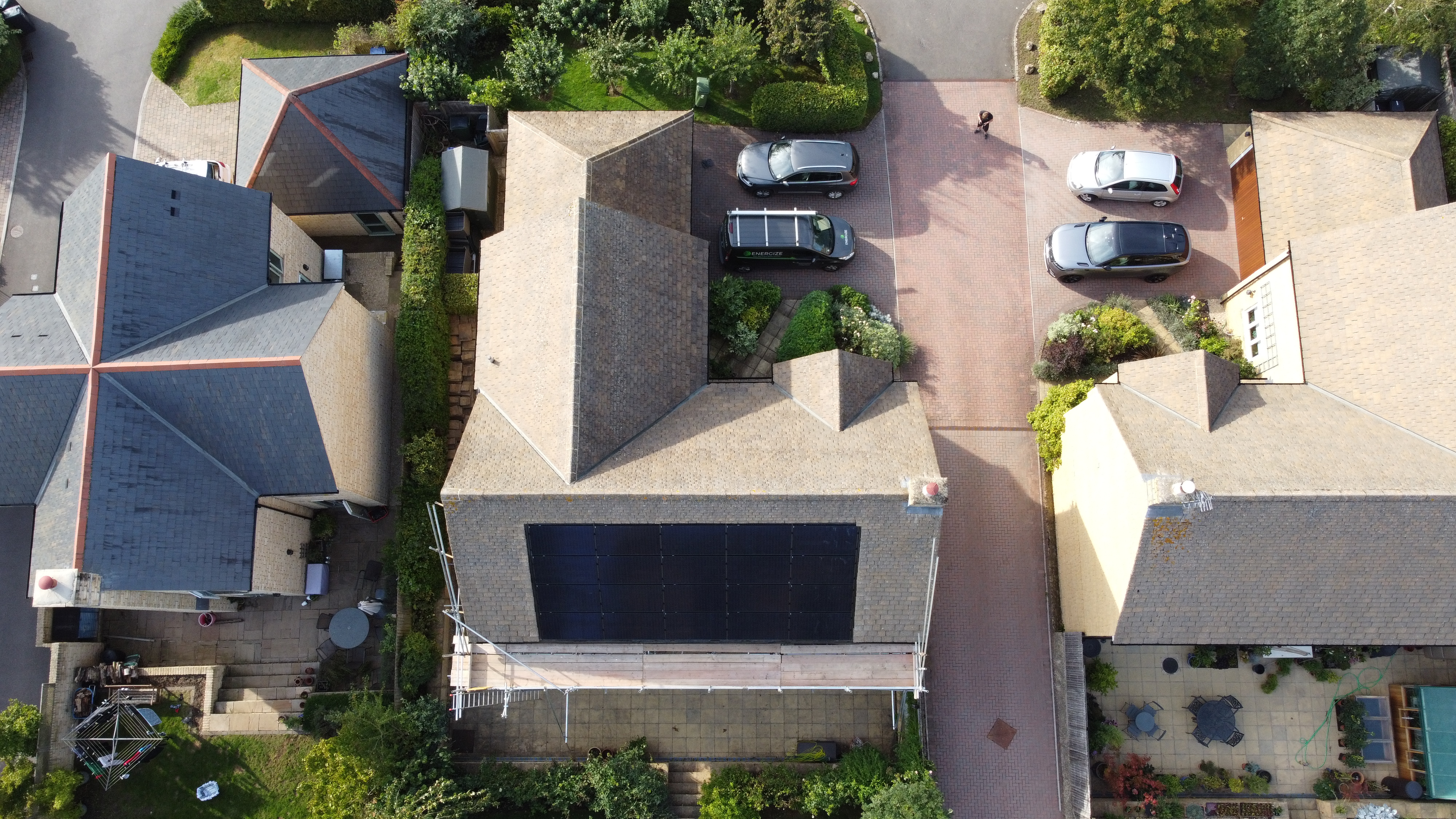 Aerial view of solar panels on coastal property extension roof