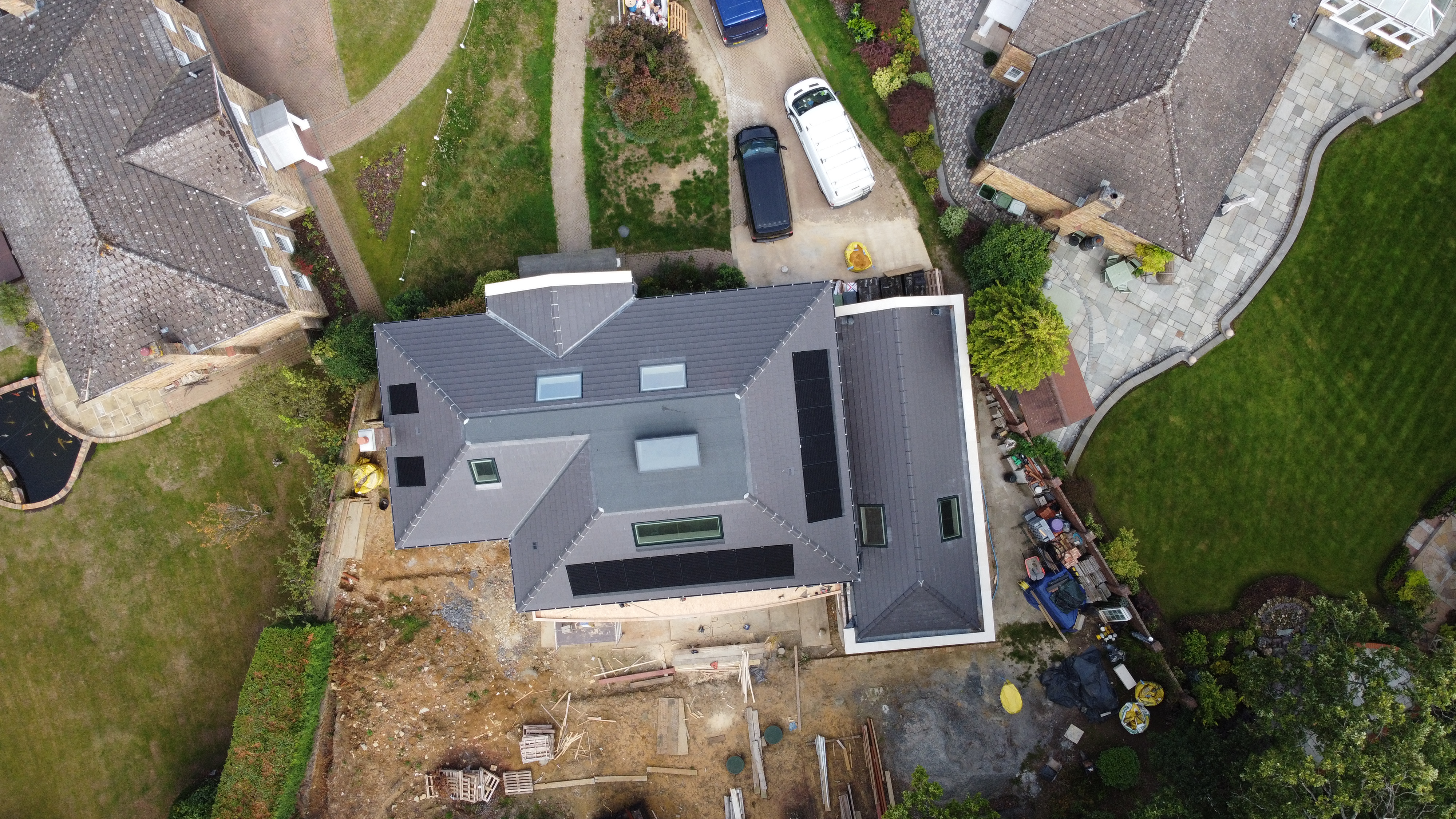 Overhead drone shot of large solar array on outbuilding roof